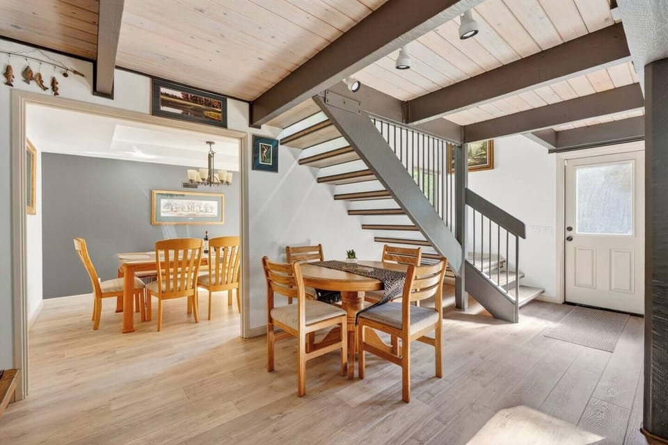 A charming breakfast nook with seating for four, perfectly situated between the living and dining areas—ideal for morning coffee, casual meals, or a quick game with family.

