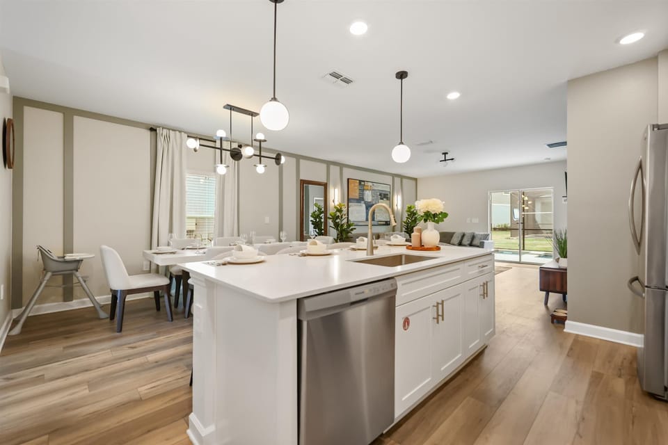 Kitchen view overlooking dining area, ideal for seamless cooking and family meal moments