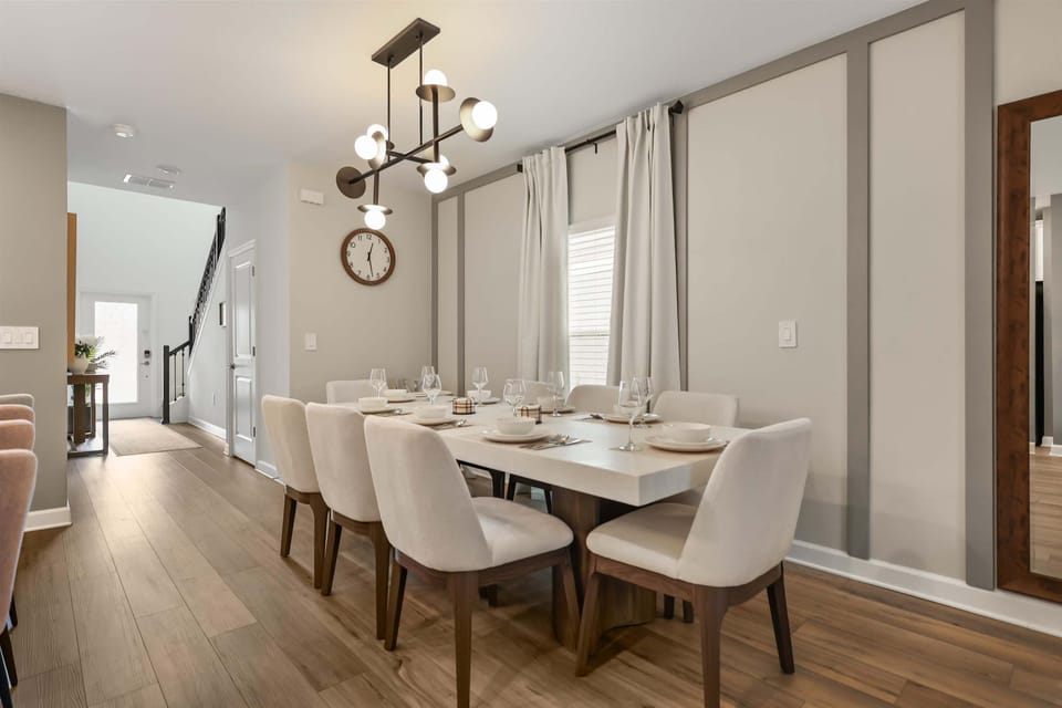 Dining area with table for 8, ideal for shared meals and family gatherings