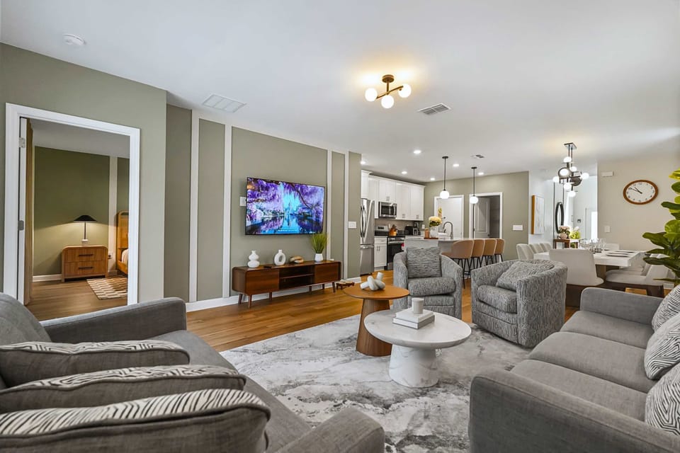 Gather, dine, and unwind in the open living area with ample seating and a large TV