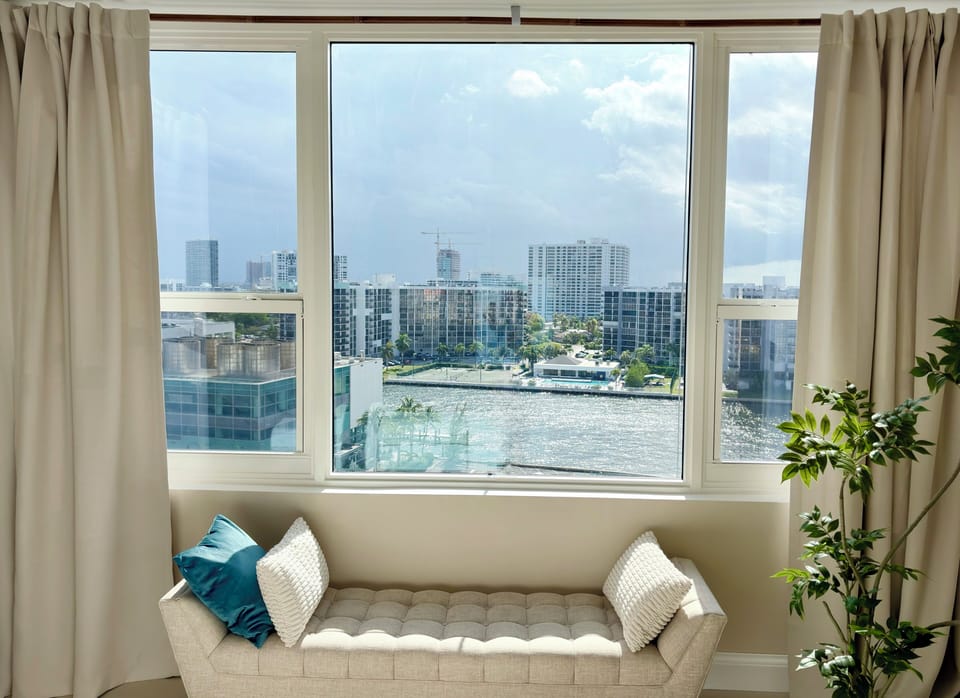 Master bedroom features a relaxing window seating with water views.