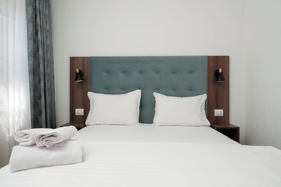 Deluxe Triple Room, City View | Desk, laptop workspace, free WiFi