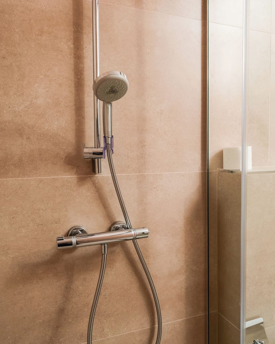 Deluxe Triple Room, City View | Bathroom | Shower, towels, soap, shampoo