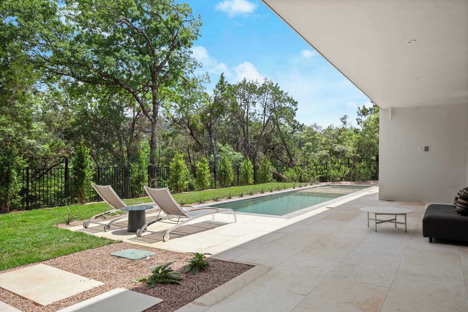 Surrounded by lush greenery, this pool feels like your own private resort escape.