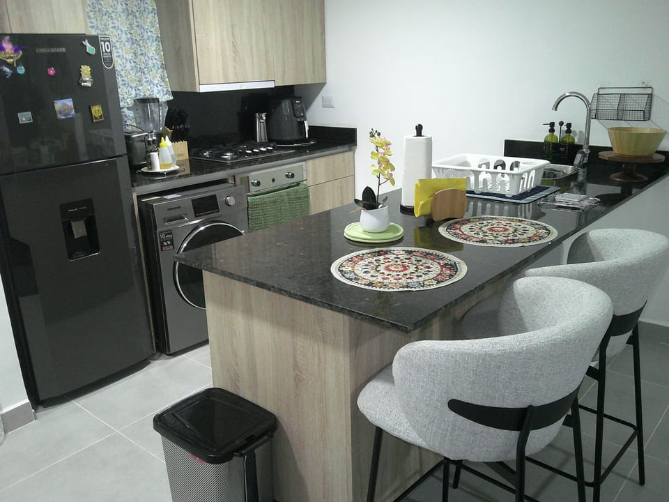 Bright and modern kitchen fully equipped for a comfortable stay. 
