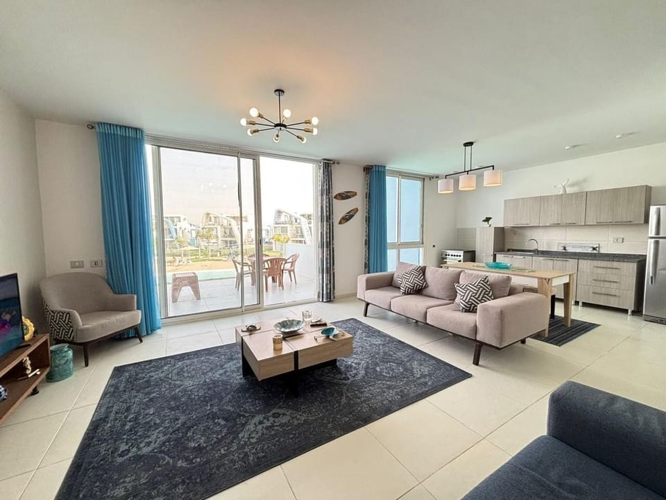 Chalet, 2 Bedrooms, Lagoon View | Living area | Flat-screen TV