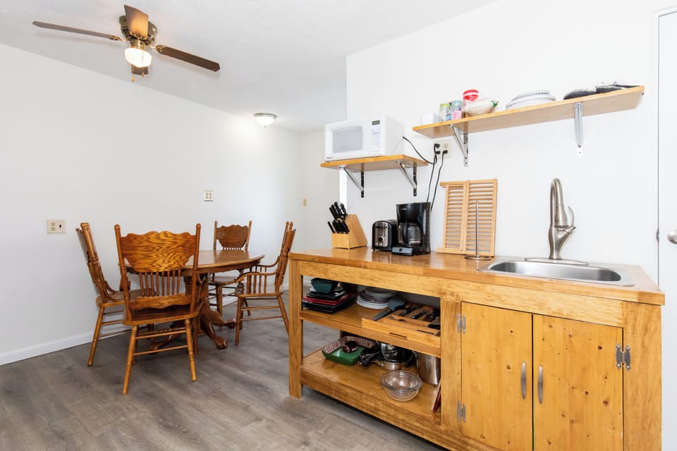 Full kitchen stocked with the basics, right off the dining table