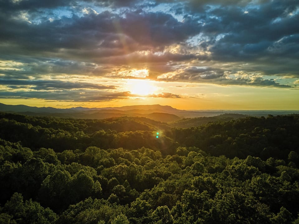 Stunning sunset views over rolling mountains and lush forest
