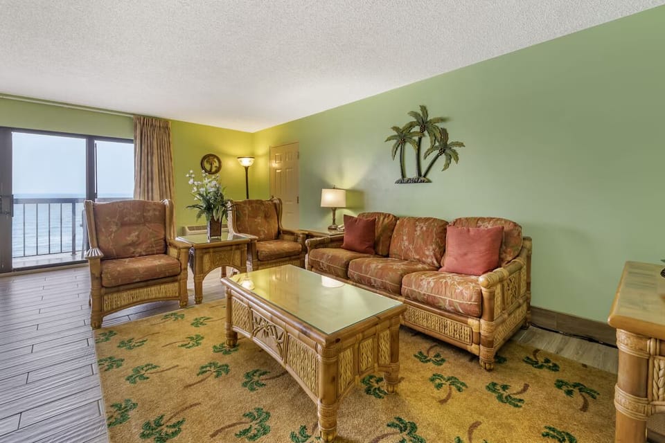 Gather on cozy seating and savor ocean breezes nearby.