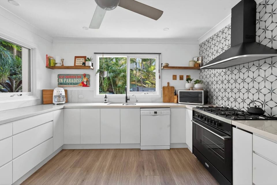 Prepare meals with ease in the well-equipped kitchen, where generous space, modern appliances, and natural light make cooking feel effortless and inviting.