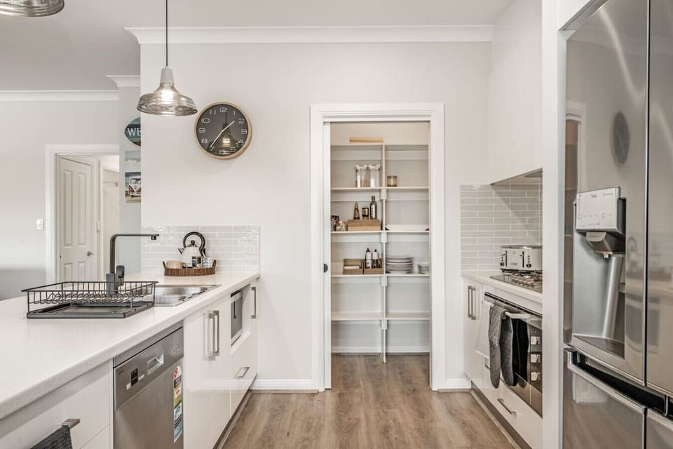 Enjoy a spacious kitchen with modern appliances, generous bench space, and a walk-in pantry to keep everything within easy reach.