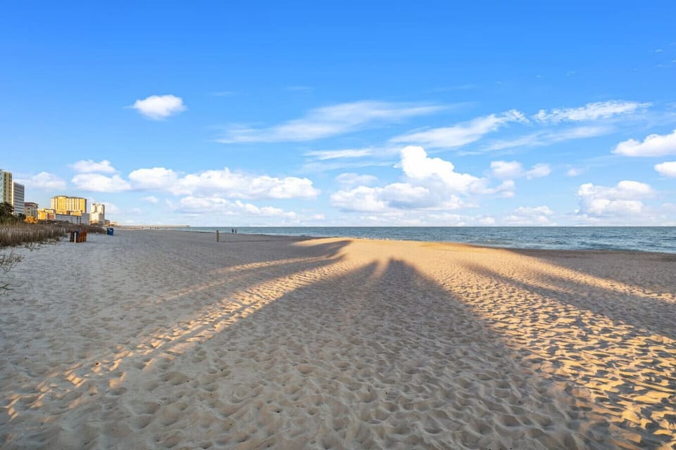 Direct beach access to Myrtle Beach’s beautiful sandy shoreline, perfect for sunbathing, swimming, family fun, and unforgettable oceanfront relaxation.