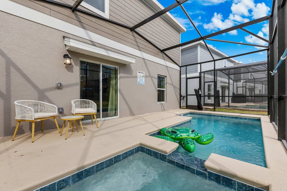 Relax on the screened lanai with private pool and spillover spa, plus cozy bistro chairs-perfect for morning coffee and afternoon dips.