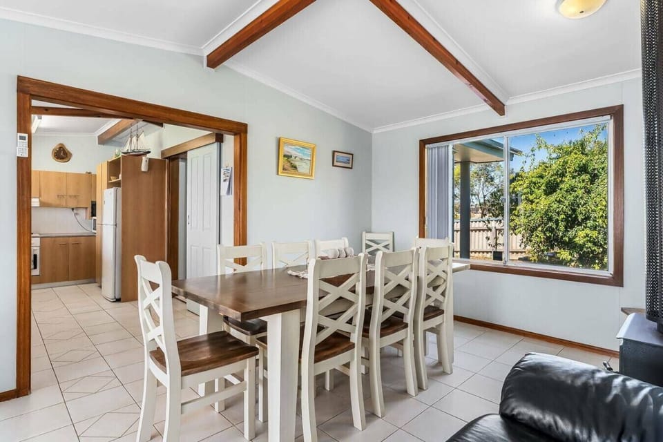 Gather around the dining table for shared meals, board games, or a quiet evening by the warmth of the fireplace.