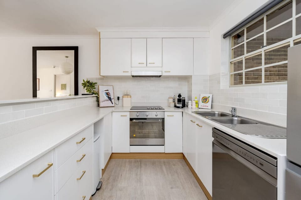 Cook up your favourite meals in the clean, modern kitchen featuring everything you need for your stay.