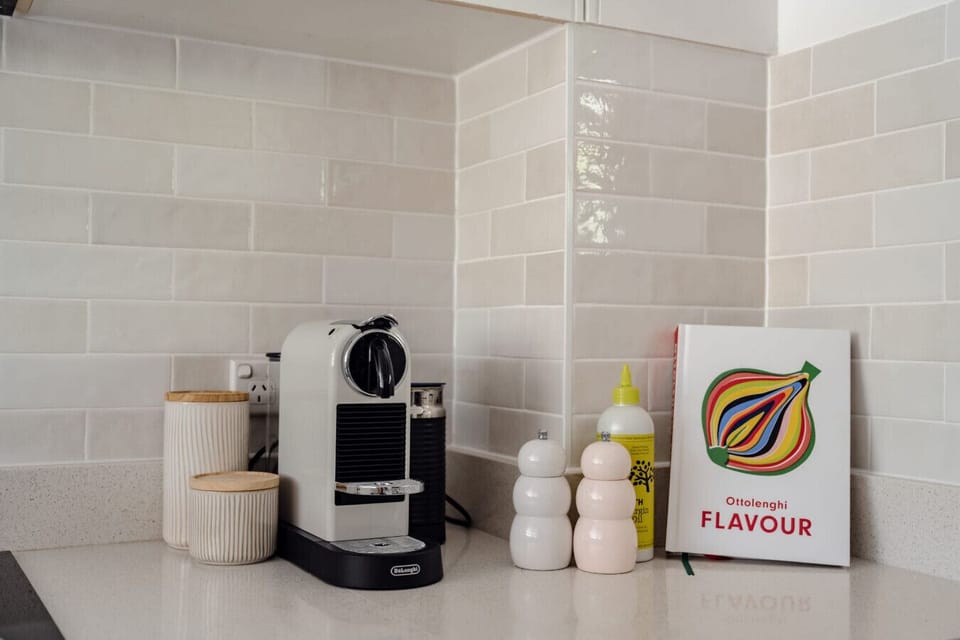 Start your mornings right with a fresh coffee in the fully equipped kitchen space.