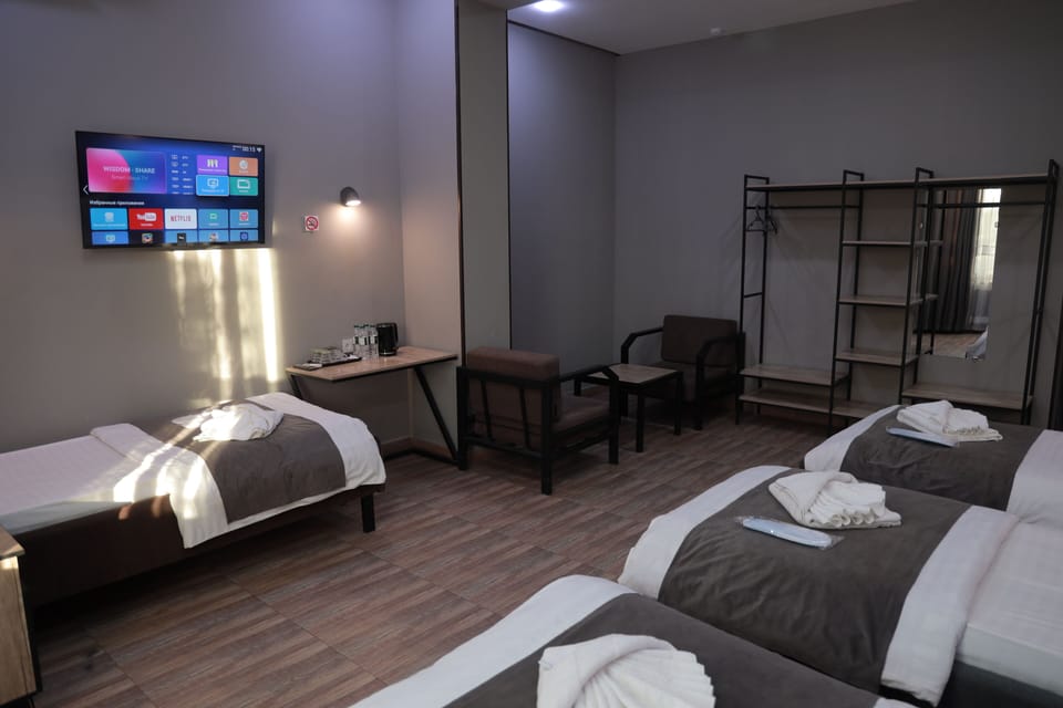 Standard Quadruple Room, City View | Desk, laptop workspace