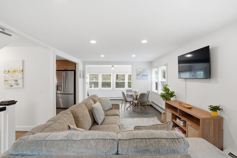 Designed for togetherness: Enjoy ocean breezes from the living area, which features a full-sized pullout sofa and seamless flow into the dining space.