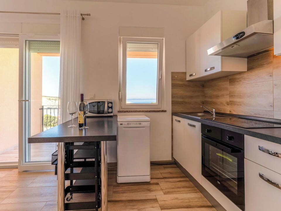 Furniture, Interior Design, Flooring, Wood, Major Appliance, Floor, Kitchen, Wood Flooring, Countertop, Room