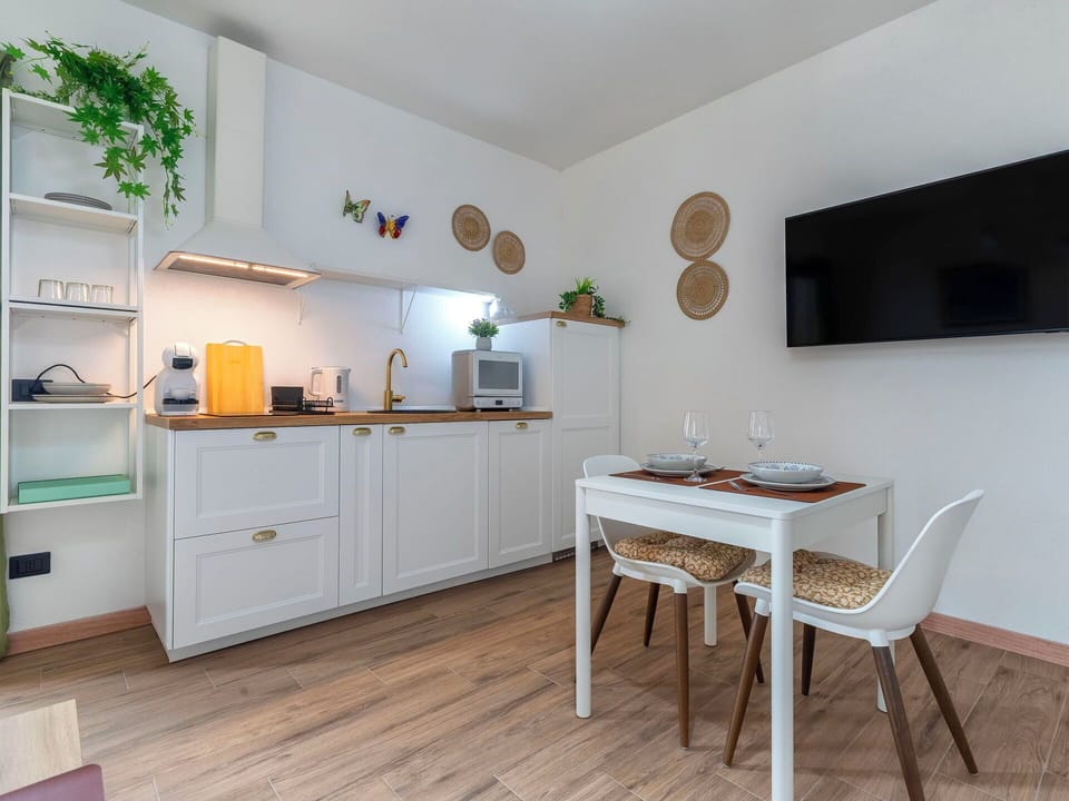 Furniture, Interior Design, Wood, Flooring, Cabinetry, Kitchen, Room, Countertop, Major Appliance, Kitchen Appliance