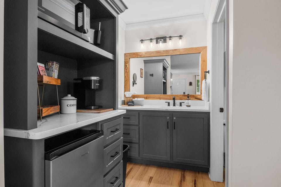 Coffee bar stocked and ready. Keurig, mugs, and everything you need to start the morning right.