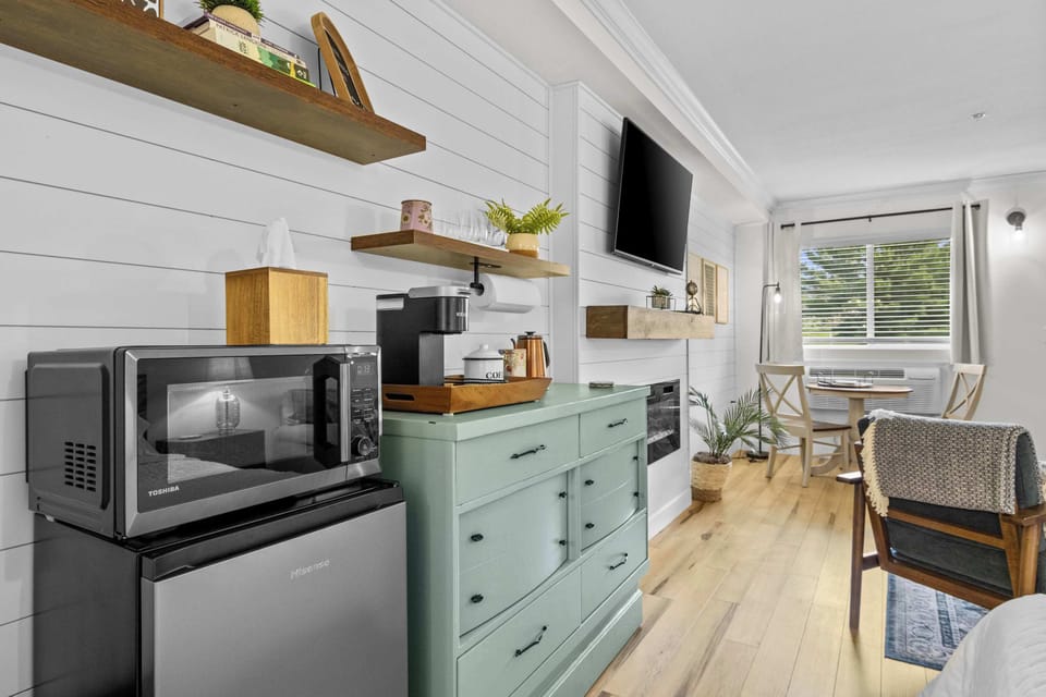 Microwave, mini fridge, and prep space. Everything you need for breakfast or a late-night snack.