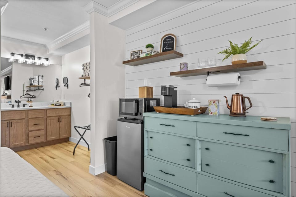 Coffee bar with a Keurig, microwave, mini fridge, and the essentials. Quiet mornings start here.