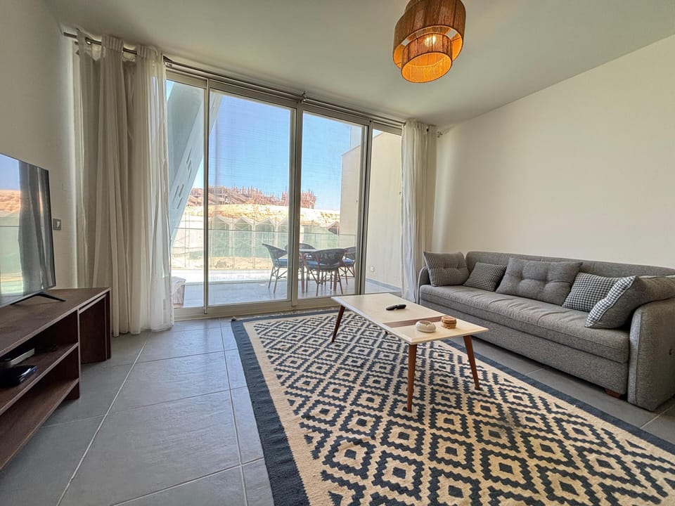 Chalet, 3 Bedrooms, Lagoon View | Living area | Flat-screen TV
