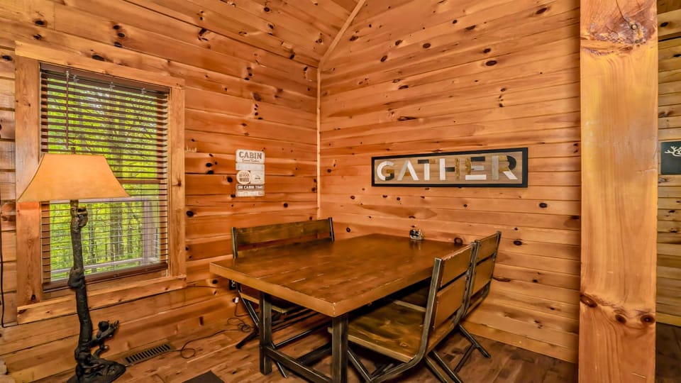 Gather around the dining table with seating for four, perfect for shared meals and easy conversation.