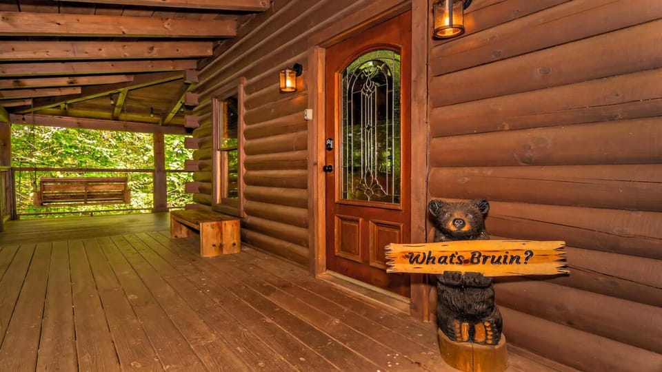 Relax on the front porch with a cozy swing, the perfect spot to unwind before stepping inside.
