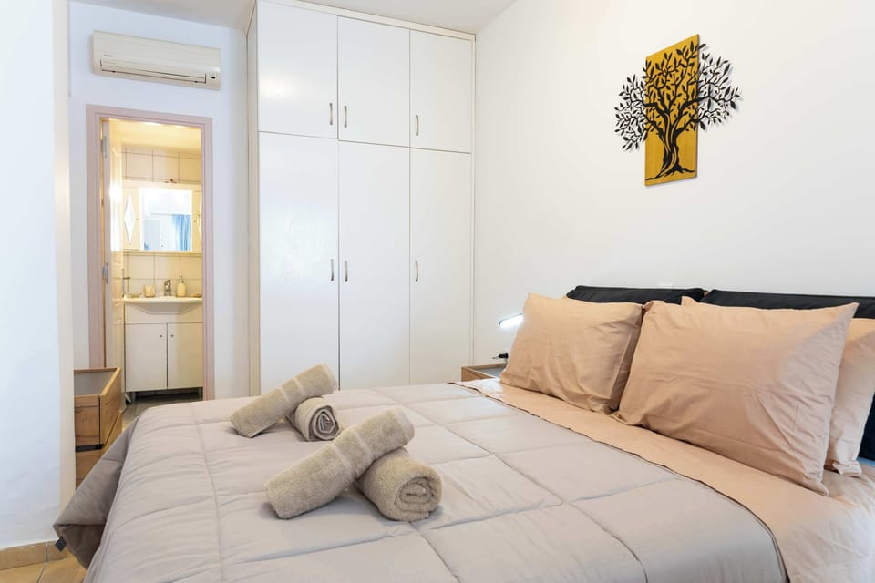 Peaceful bedroom with soft linens and natural light