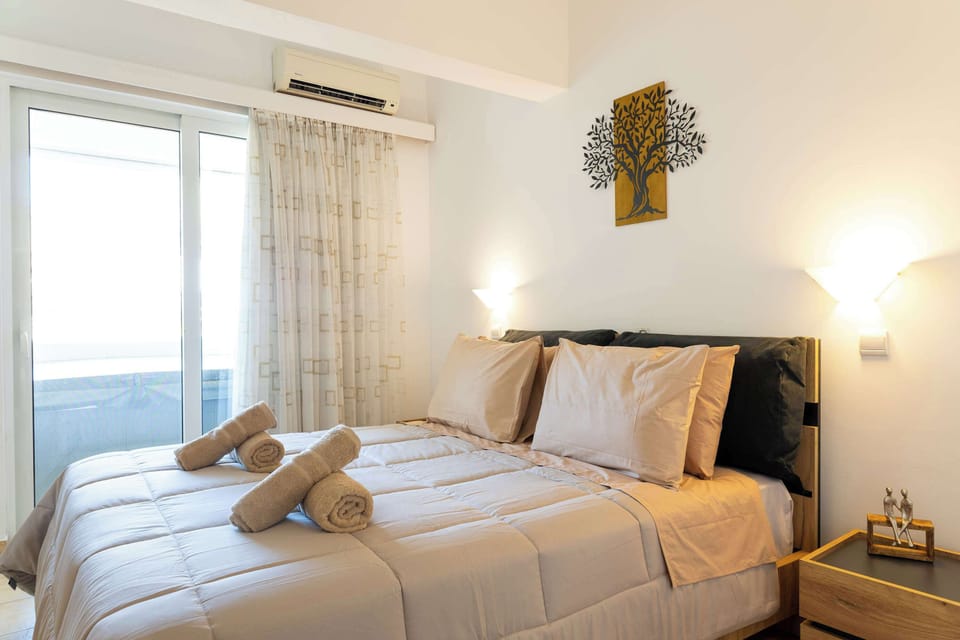 Serene bedroom with balcony access and soft décor
