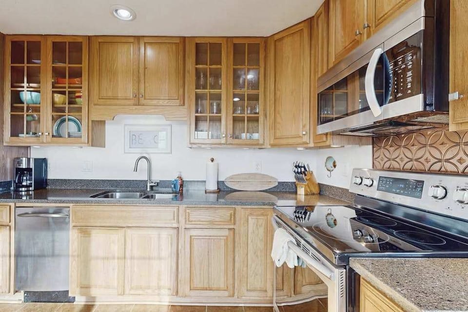 Your Bodega Bay kitchen is stocked and ready — a coffee maker for foggy mornings, glass-front cabinets, and all the cookware you need for a Sonoma Coast feast.
