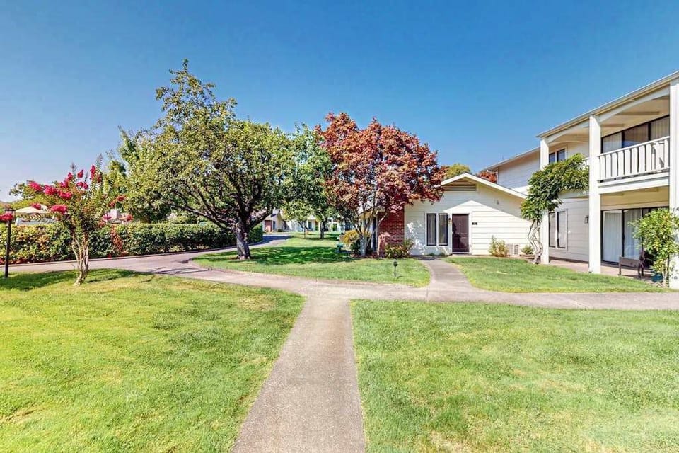 Stroll along tree-shaded pathways through Silverado's beautifully landscaped grounds — your ground-floor condo is nestled among flowering gardens.