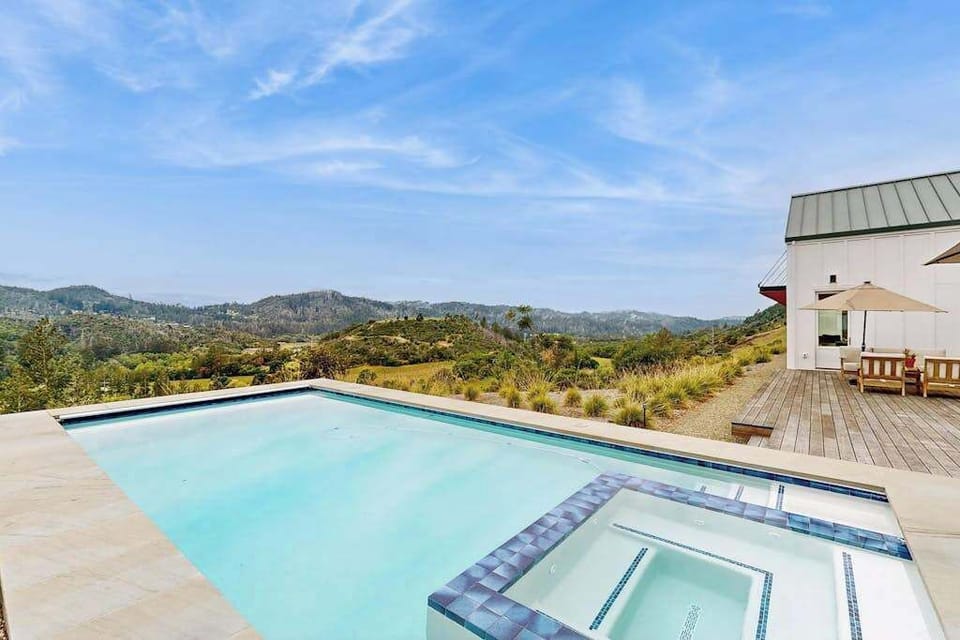 Glide into your private heated pool and spa perched above the Calistoga hills — your personal infinity of vineyard-dotted mountains stretching to the horizon.