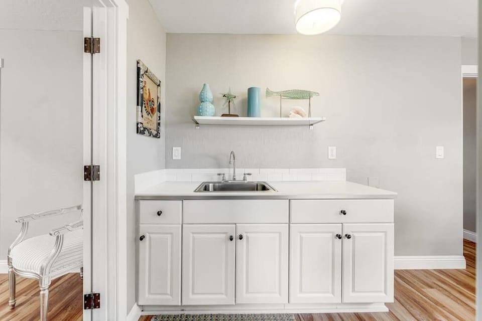 Freshen up at the convenient wet bar with its own sink — handy for rinsing wine glasses after a Sonoma Coast tasting day.
