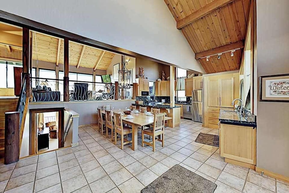 Share farm-to-table feasts at the wood dining table for six, steps from your fully equipped gourmet kitchen with vaulted tongue-and-groove ceilings overhead.