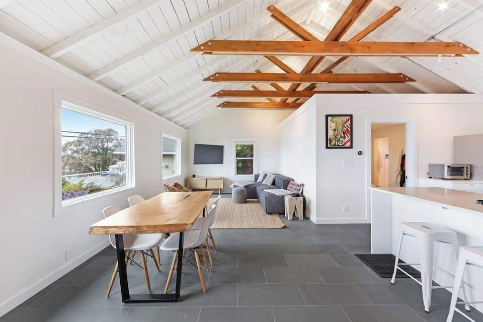 From the dining table to the living room, this open floor plan invites easy conversation and relaxation throughout your stay.