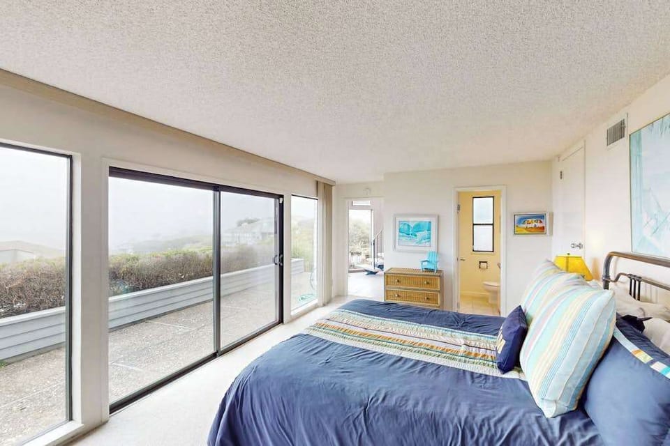 Slide open your glass doors and let the Bodega Bay breeze fill your king suite — sweeping coastal views and private deck access await you