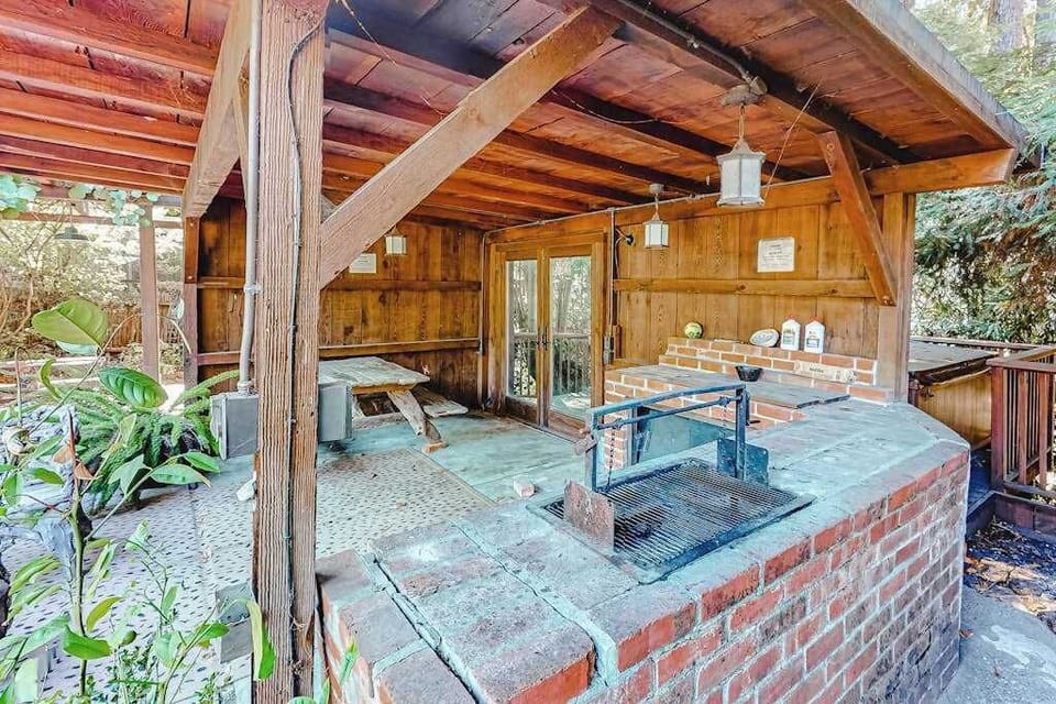 Fire up the built-in brick BBQ under your covered outdoor kitchen — perfect for grilling after a lazy Russian River float day.