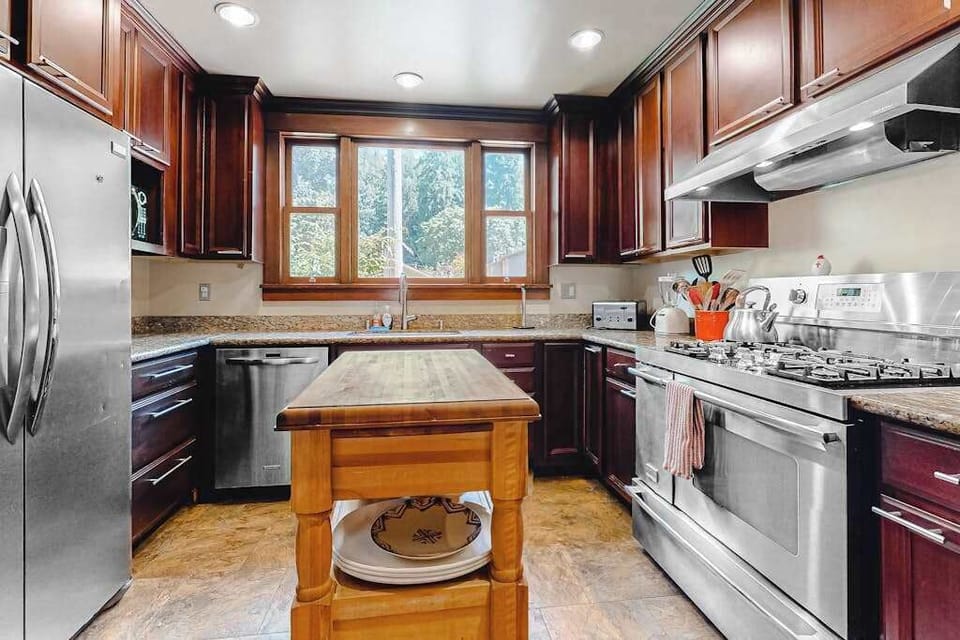 Spread out and create — your kitchen pairs a French-door refrigerator with a pro-style gas range, dishwasher, and ample counter space for group meals.
