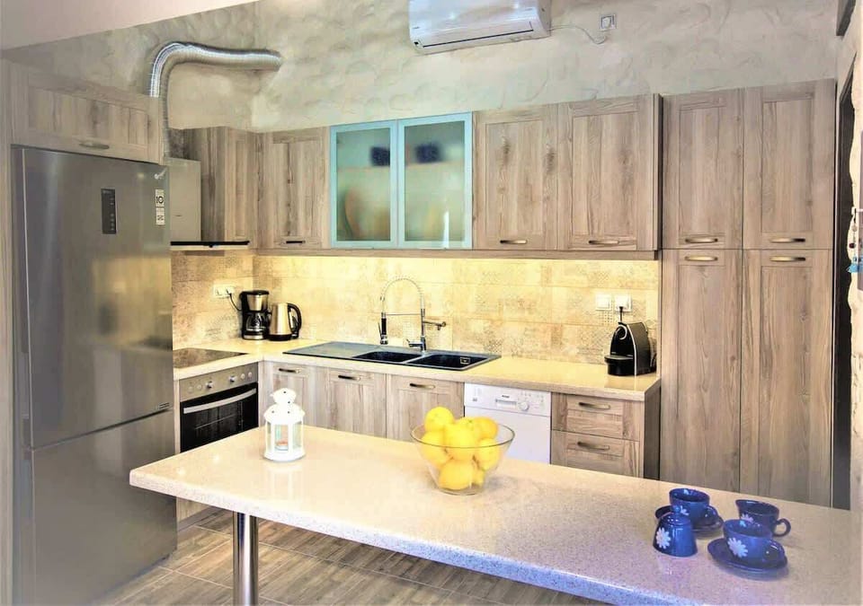 Close view of the kitchen setup, highlighting the materials and layout designed for practical daily use.