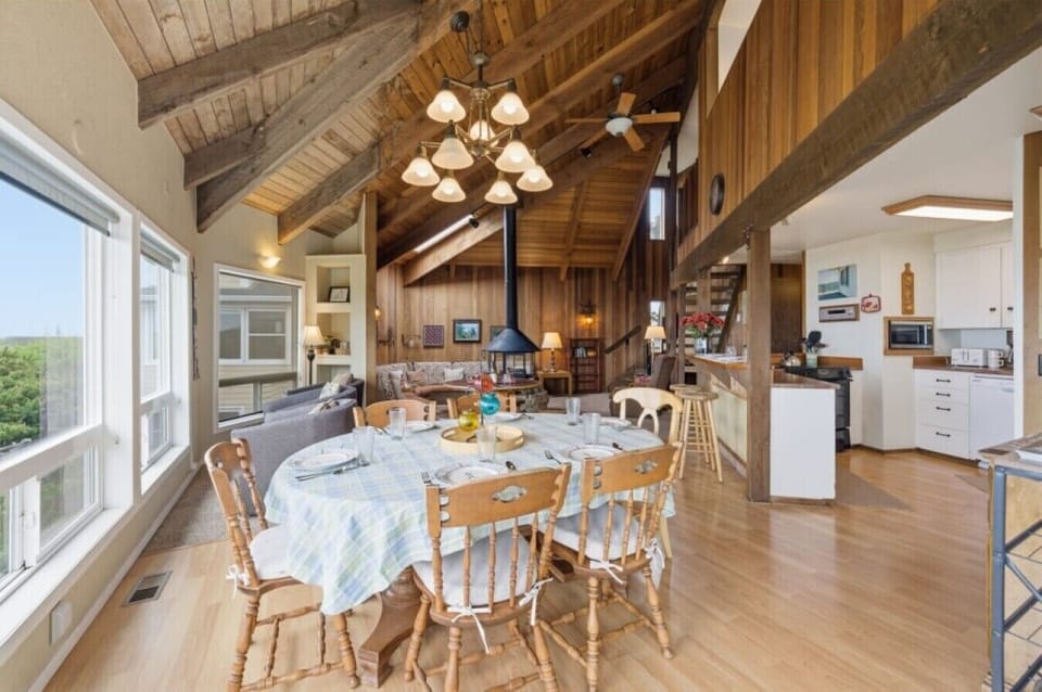 Dining Area | Wood Table | Open Living Room & Window Views