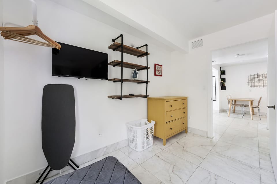 Family Apartment, 2 Bedrooms, Balcony (Self check-in) | Desk, laptop workspace, blackout drapes, iron/ironing board