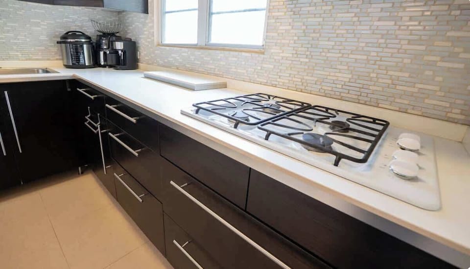 Cook comfortably with a full-size gas stove and everyday essentials.