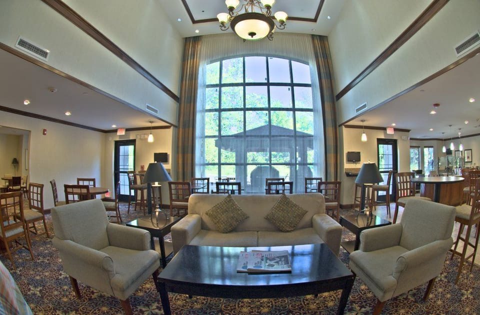 Relax in the spacious lounge area, where natural light floods through grand windows.