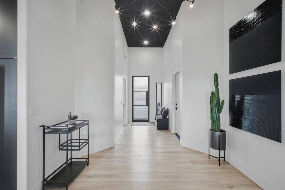 Sleek, modern entryway leading into an open-concept layout.