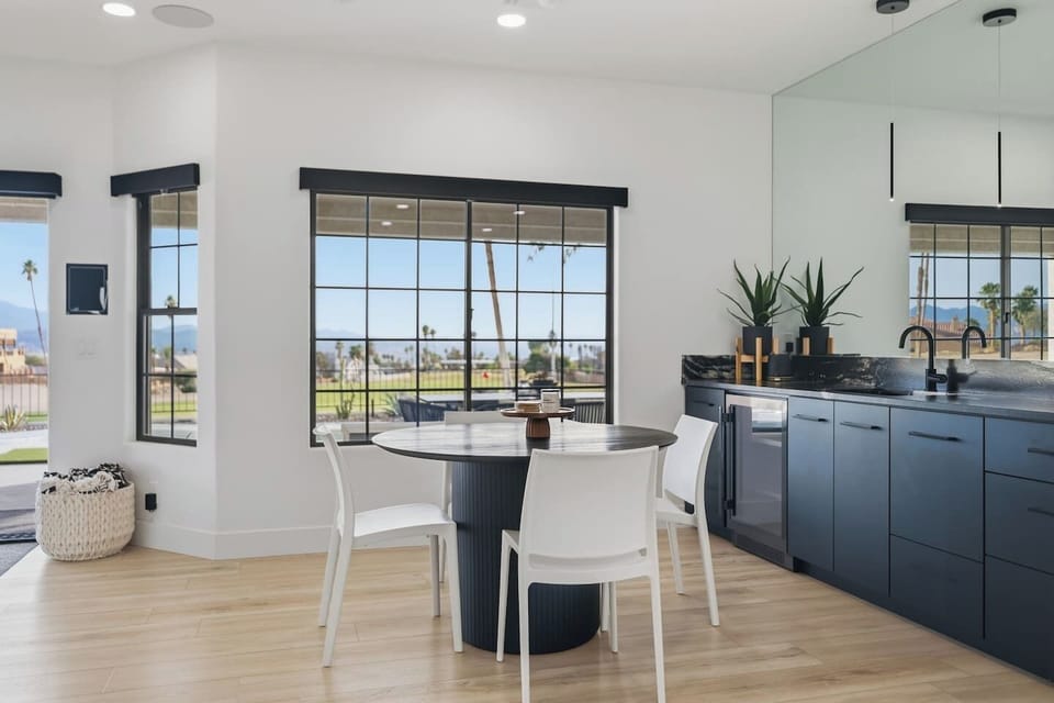 Modern dining table with seating for four and beautiful natural light.