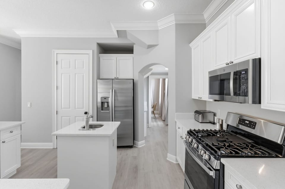 Fully equipped kitchen with oversized island and seating for casual dining