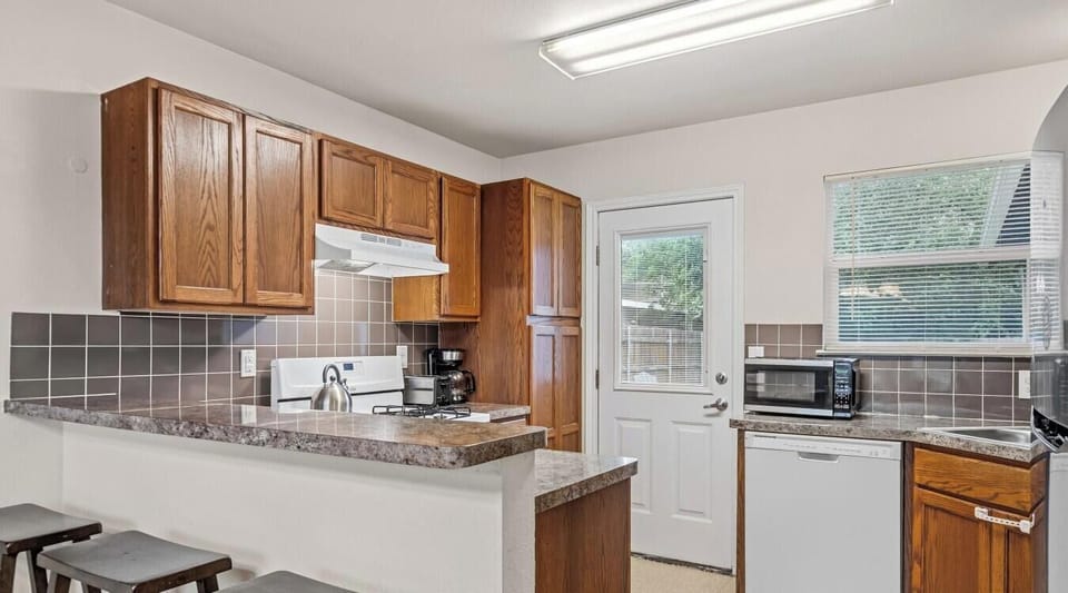 Cook up a feast in the bright, fully equipped kitchen with ample counter space and all the essentials.